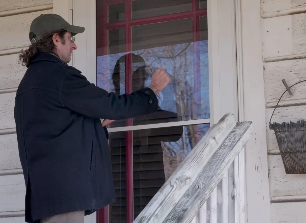 A man knocking a door