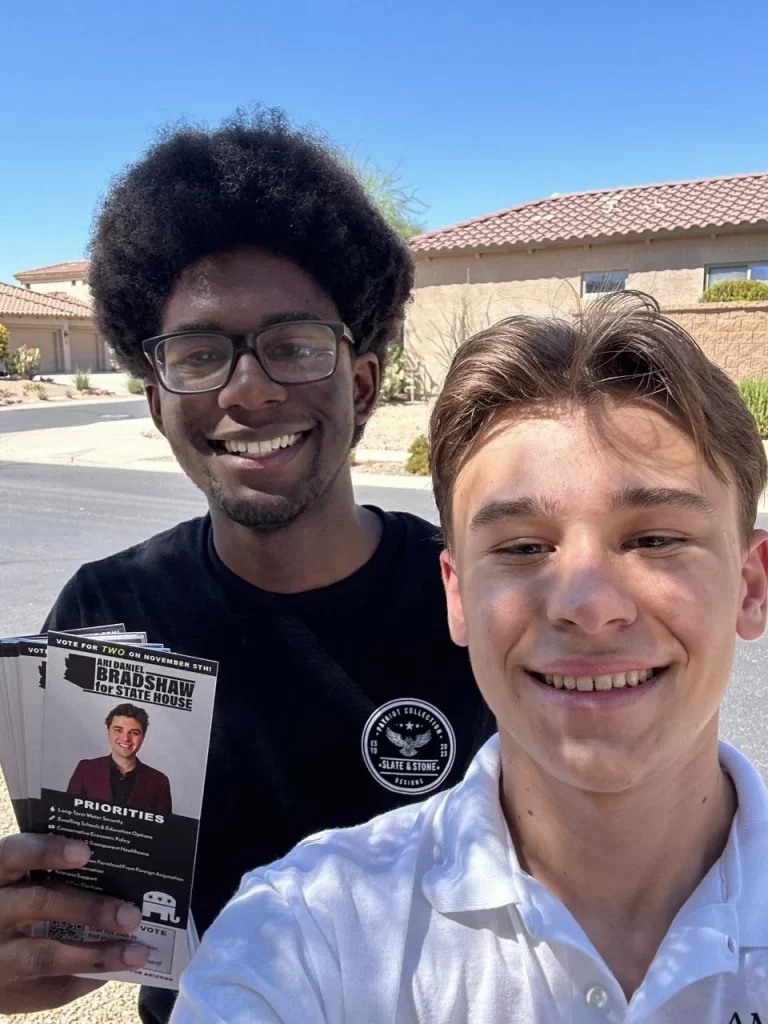 Nico Delgado and Isaac Glover canvassing doors for Ari Daniel Bradshaw's 2024 State House run