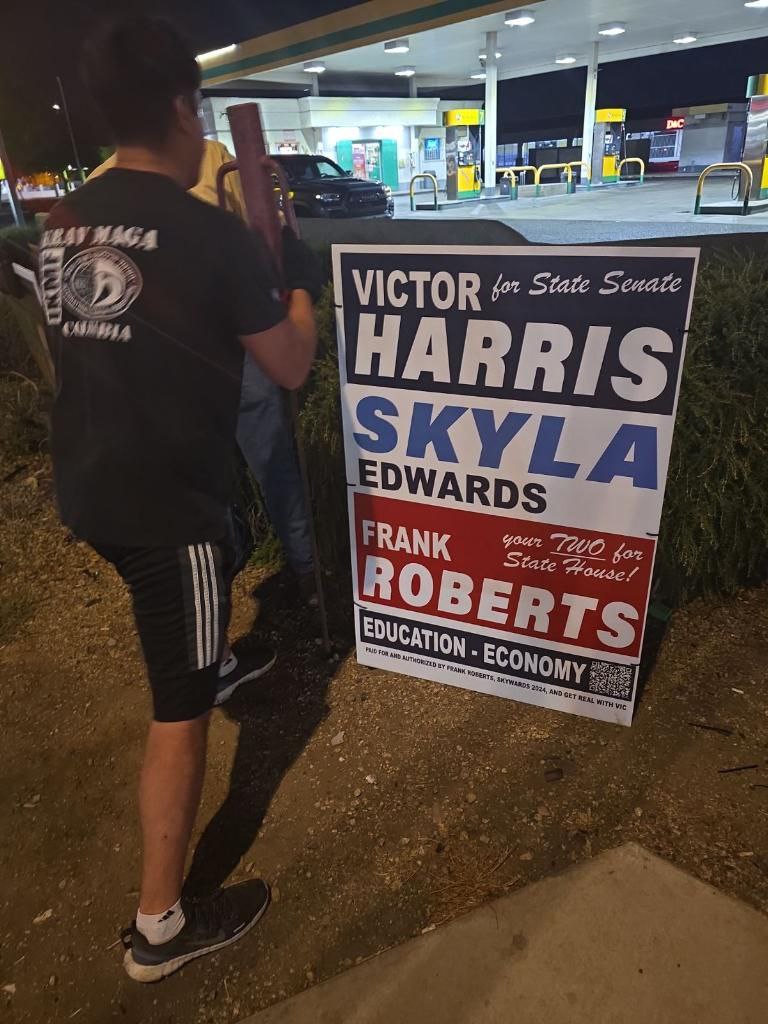 David Mendoza Pounding a Sign for Victor Harris, Skyla Edwards, and Frank Roberts in LD26 in 2024
