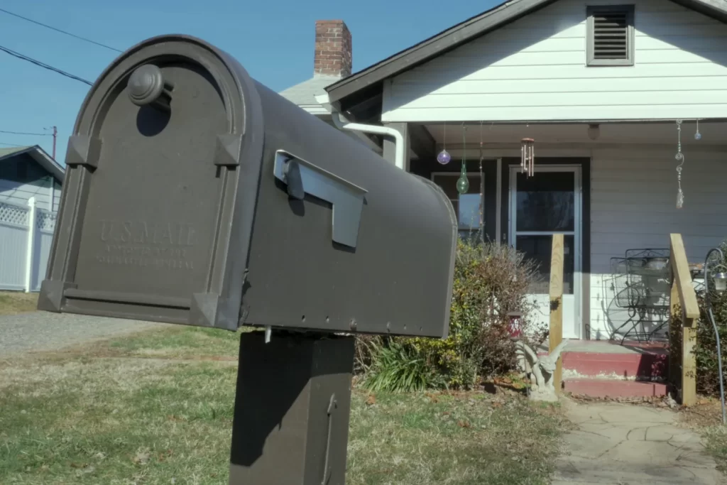 A Mailbox in Front of a Suburban Home